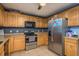 Efficient kitchen boasts modern appliances, ample counter space, and abundant cabinet storage at 333 Acropolis Dr, Dunedin, FL 34698