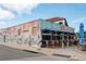 The Living Room Restaurant exterior with patio seating and vibrant mural at 333 Acropolis Dr, Dunedin, FL 34698