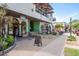 Attractive shopping center with diverse storefronts and outdoor seating areas at 333 Acropolis Dr, Dunedin, FL 34698