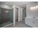 Bathroom features a glass door shower, a toilet room, and a vanity sink area at 3926 Southern Valley Loop, Brooksville, FL 34601