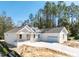 An elegant home boasting a brick driveway, a two-car garage, and a blend of modern and country-style architecture at 3926 Southern Valley Loop, Brooksville, FL 34601