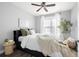 Cozy bedroom features luxury vinyl plank flooring, neutral paint, and a modern ceiling fan at 4221 W Spruce St # 1229, Tampa, FL 33607