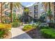 A serene courtyard with lush greenery, a water fountain, and decorative structures for relaxation at 4221 W Spruce St # 1229, Tampa, FL 33607