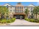 Beautiful condo building featuring a covered driveway and professionally landscaped grounds at 4221 W Spruce St # 1229, Tampa, FL 33607