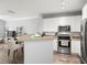Bright kitchen featuring modern appliances and a view of the living area at 4221 W Spruce St # 1229, Tampa, FL 33607
