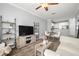 Open-concept floor plan featuring luxury vinyl plank flooring, living room, dining area, and kitchen at 4221 W Spruce St # 1229, Tampa, FL 33607