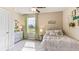 Cozy bedroom with comfortable bed, stylish decor, and a window with a backyard view at 4439 Sand Dollar Way, Zephyrhills, FL 33541
