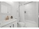 Elegant bathroom with marble tiled shower, white vanity, and modern fixtures at 4561 21St S Ave, St Petersburg, FL 33711