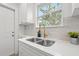 Well-lit kitchen sink with stainless steel double basin and ample countertop space at 4561 21St S Ave, St Petersburg, FL 33711