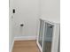 A utility room with hookups and what looks to be a replacement window on the floor at 4561 21St S Ave, St Petersburg, FL 33711
