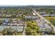 Aerial view featuring the property's proximity to community tennis courts, pool, and city skyline at 4681 1St Ne St # 306, St Petersburg, FL 33703