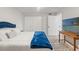 Comfortable bedroom with a blue-themed decor and plenty of natural light at 4681 1St Ne St # 306, St Petersburg, FL 33703