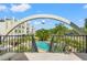 Beautiful community pool area with lush tropical landscaping and inviting lounge seating at 4681 1St Ne St # 306, St Petersburg, FL 33703