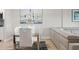 Open-concept living area with dining table, comfortable sofa, and stylish decor at 4681 1St Ne St # 306, St Petersburg, FL 33703