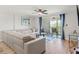 Comfortable living room area with sliding glass doors to the outdoor seating at 4681 1St Ne St # 306, St Petersburg, FL 33703