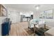 Bright open-concept dining and kitchen with stainless steel appliances and stylish backsplash at 4681 1St Ne St # 306, St Petersburg, FL 33703