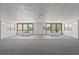 Bright spacious lobby with well-maintained carpet and greenery, with access to outdoor spaces at 4681 1St Ne St # 306, St Petersburg, FL 33703