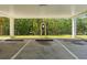 View of the covered parking area with designated parking spots at 4681 1St Ne St # 306, St Petersburg, FL 33703