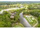 A panoramic aerial view showcasing the property's golf course location and pond at 50 St Andrews Pl # 50, Oldsmar, FL 34677