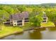 Overhead of the property features green lawns and lakeside views at 50 St Andrews Pl # 50, Oldsmar, FL 34677