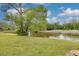 Serene backyard view of the pond and golf course at 50 St Andrews Pl # 50, Oldsmar, FL 34677