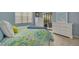 Well-lit bedroom with a dresser and access to outdoor seating at 50 St Andrews Pl # 50, Oldsmar, FL 34677