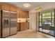 Bright kitchen featuring stainless steel appliances, granite countertops, and ample cabinet space at 50 St Andrews Pl # 50, Oldsmar, FL 34677