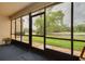 Enclosed lanai with beautiful golf course and pond views, perfect for relaxing and enjoying the scenery at 50 St Andrews Pl # 50, Oldsmar, FL 34677