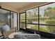 Comfortable lanai area with seating and views of the parking area at 50 St Andrews Pl # 50, Oldsmar, FL 34677