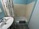 Bathroom featuring tile-surround shower, a soaking tub, and floral shower curtain at 501 East Bay Dr. # 2003, Largo, FL 33770