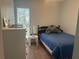 A sunlit bedroom with wood floors and a comfortable twin bed at 501 East Bay Dr. # 2003, Largo, FL 33770