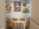 Cozy dining area with botanical wall art and a small table for intimate meals at 501 East Bay Dr. # 2003, Largo, FL 33770