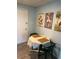 Cozy dining area with blue walls, botanical wall art, and a small table for intimate meals at 501 East Bay Dr. # 2003, Largo, FL 33770