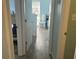Hallway view of bedroom with wood-look tile flooring, and light blue walls at 501 East Bay Dr. # 2003, Largo, FL 33770