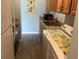 Functional laundry area with a sink, ample counter space, and a washing machine for added convenience at 501 East Bay Dr. # 2003, Largo, FL 33770