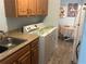 Functional laundry area with a sink, ample counter space, and a washing machine for added convenience at 501 East Bay Dr. # 2003, Largo, FL 33770