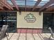 Exterior view of Magnolia Square sign with brick detail below the sign at 501 East Bay Dr. # 2003, Largo, FL 33770
