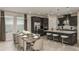 Beautiful kitchen with dark wood cabinets, stainless steel appliances, and a spacious dining area at 5128 Slate Hue Pl, Apollo Beach, FL 33572