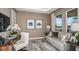Home office with a desk, comfortable seating, natural light, and view of the lake at 5128 Slate Hue Pl, Apollo Beach, FL 33572