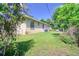 Wide view of the backyard with the exterior of the house at 513 Tweed Ave, Seffner, FL 33584