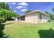 Large backyard featuring the exterior of the home with screen porch at 513 Tweed Ave, Seffner, FL 33584