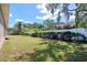 Spacious backyard with lush greenery and a privacy fence at 513 Tweed Ave, Seffner, FL 33584