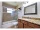 Bathroom featuring a sliding glass shower door, toilet, and vanity with granite countertop at 513 Tweed Ave, Seffner, FL 33584