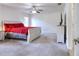 Spacious bedroom with carpet flooring, ceiling fan, and neutral color palette at 513 Tweed Ave, Seffner, FL 33584