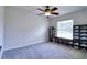Bedroom featuring a gray carpet and a window with a wall of shoes at 513 Tweed Ave, Seffner, FL 33584