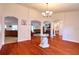 Open concept dining room with hardwood floors and chandelier lighting at 513 Tweed Ave, Seffner, FL 33584