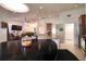 Open concept kitchen with granite counters, stainless steel appliances, and ample lighting at 513 Tweed Ave, Seffner, FL 33584