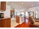 Spacious kitchen featuring an island with seating, granite countertops, and stainless appliances at 513 Tweed Ave, Seffner, FL 33584