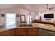A full view of the eat-in kitchen with an island, large sink and breakfast bar at 513 Tweed Ave, Seffner, FL 33584