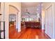 Spacious open living room with hardwood floors, ample natural light, and ceiling fan at 513 Tweed Ave, Seffner, FL 33584